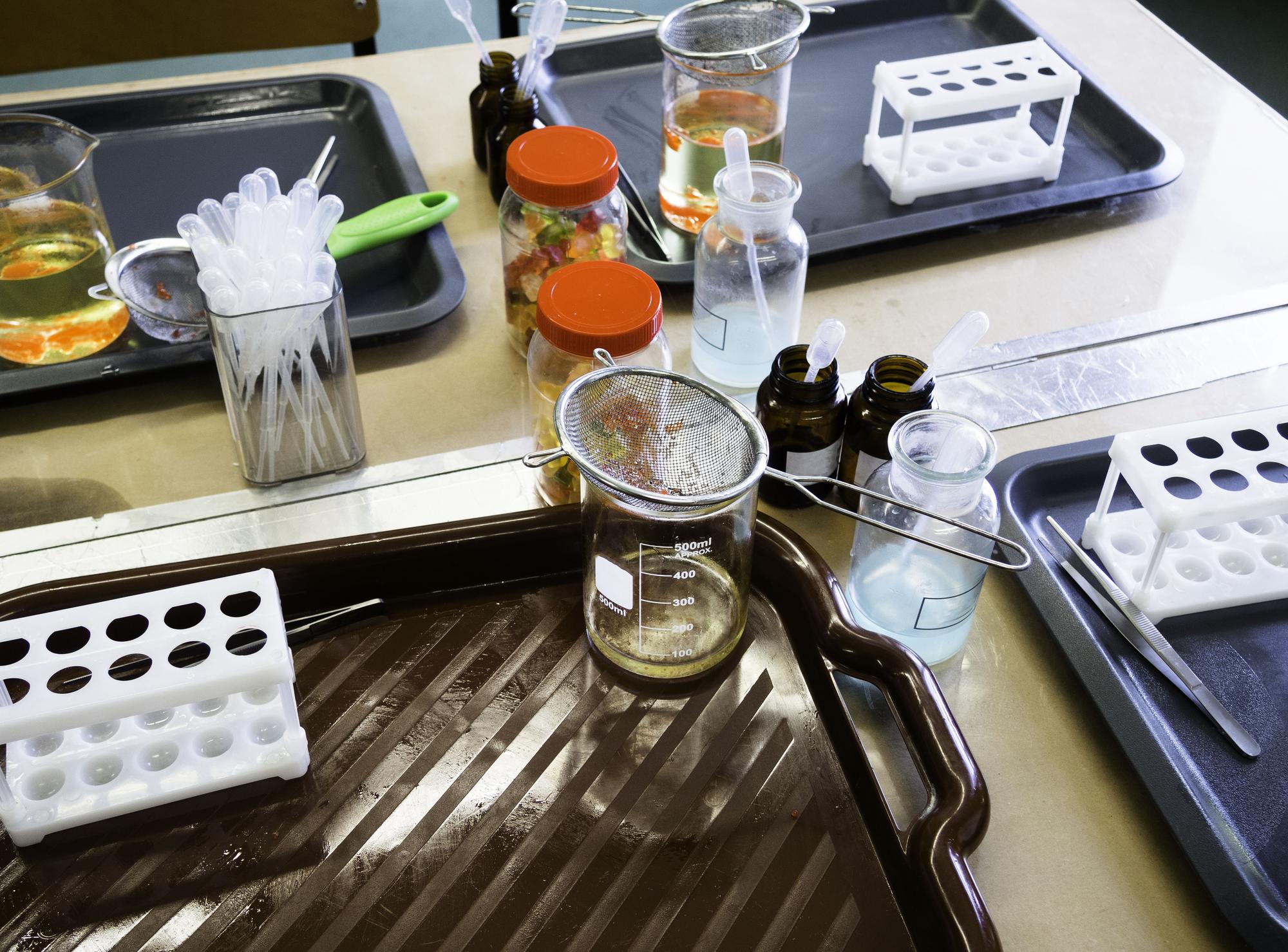 lab bench with labeled samples and scales